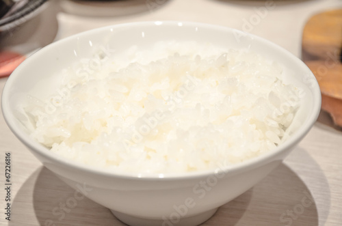 White steamed rice in white round bowl