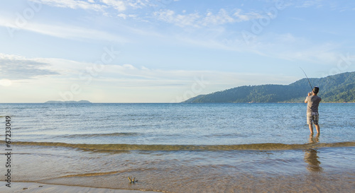 Fishing at sea shore island photo