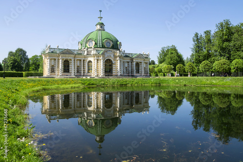 Grotto pavilion with reflection in the water park Kuskovo, Mosco