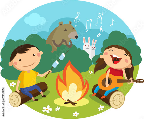 Children sit on the lawn around the campfire