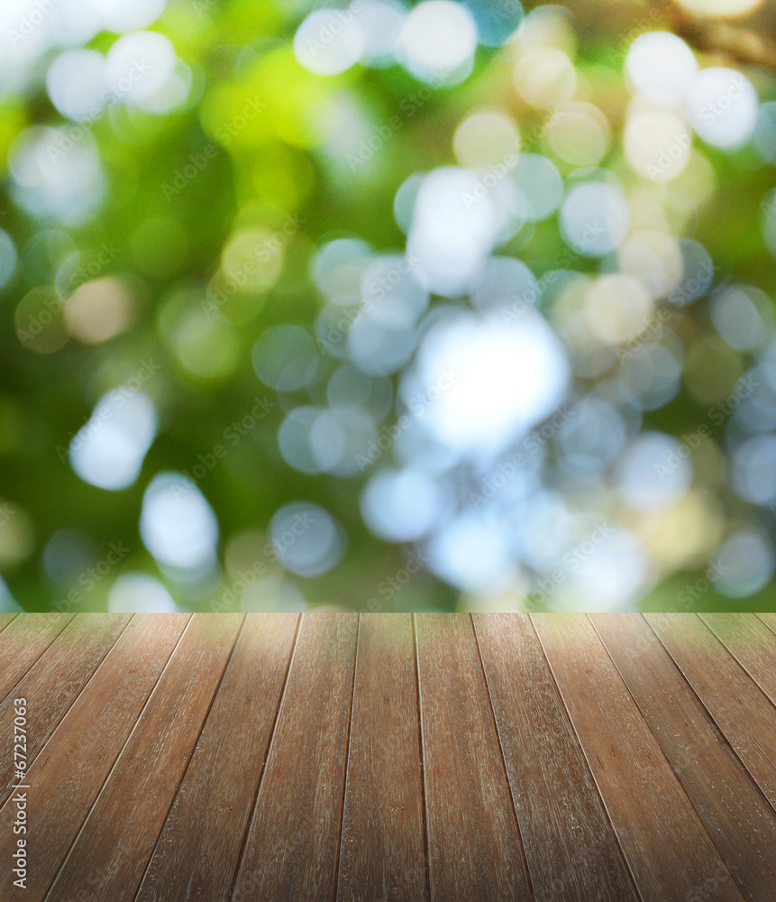Wooden deck table over beautiful bokeh background Wooden deck table over beautiful bokeh background