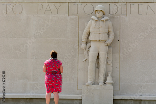 Lady paying respect at US World War Two Military cemetery photo