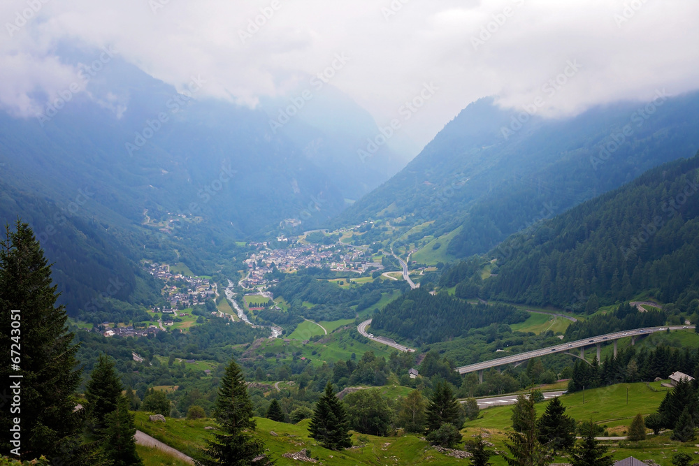 Village view in Swetzerland on a foggy day from above Village view in Swetzerland on a foggy day from above