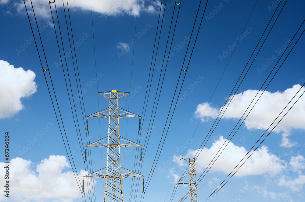 Power transmission lines against blue sky Power transmission lines against blue sky