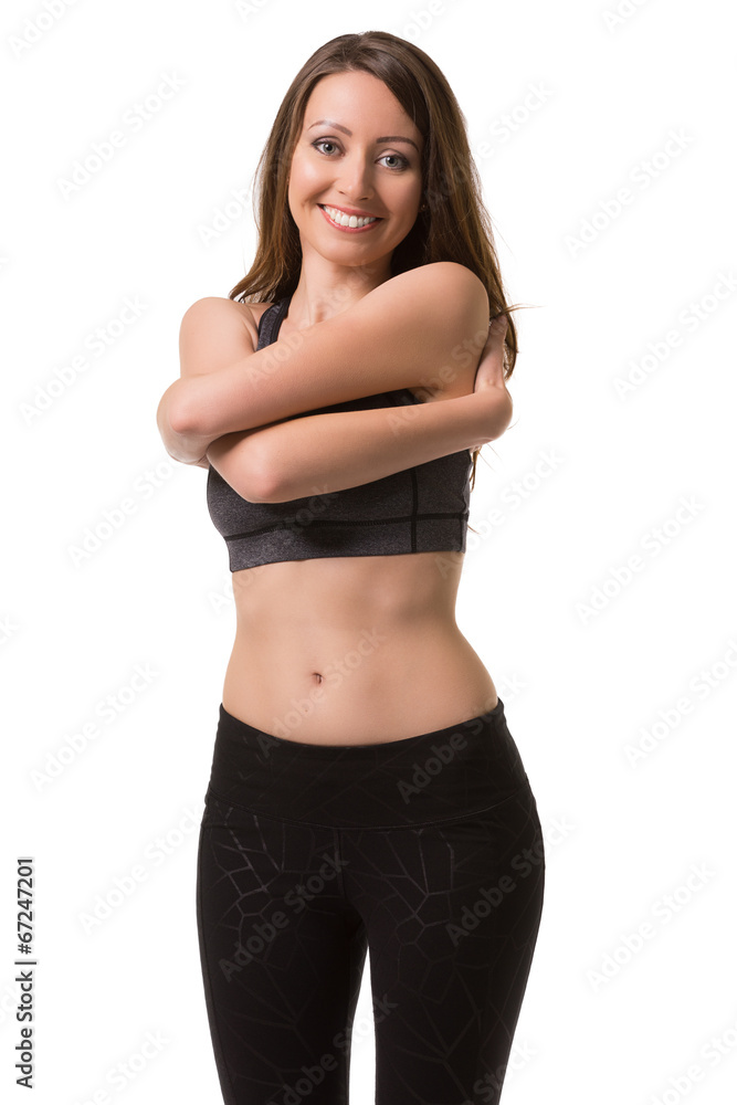Smiling woman warming up her body. Smiling woman warming up her body.