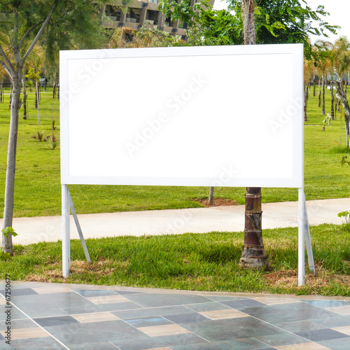 Blank billboard with tropical palm trees