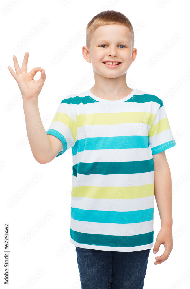 little boy in casual clothes showing OK gesture little boy in casual clothes showing OK gesture