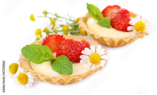 Tasty tartlets with strawberries isolated on white