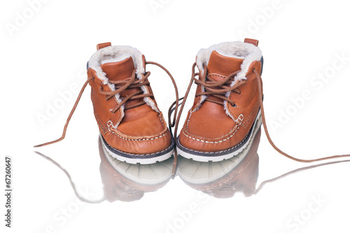 kid's leather shoes on white background