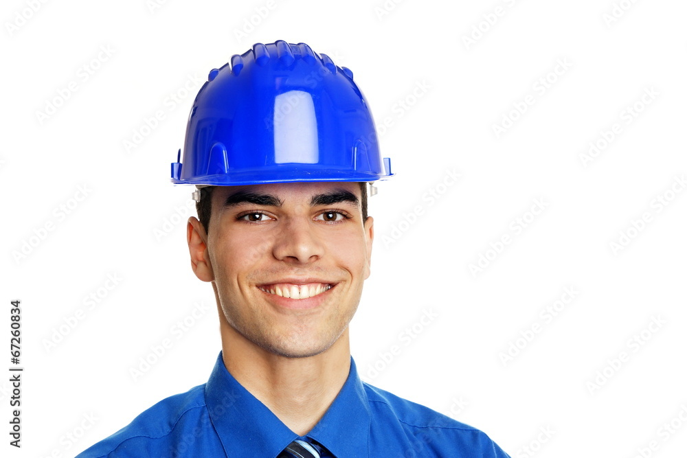 Portrait of young smiling businessman in a protective helmet Portrait of young smiling businessman in a protective helmet