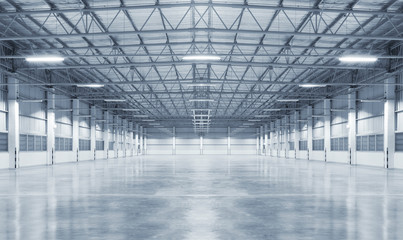 Concrete floor inside industrial building. Use as large factory, warehouse, storehouse, hangar or plant. Modern interior with metal wall and steel structure with empty space for industry background.