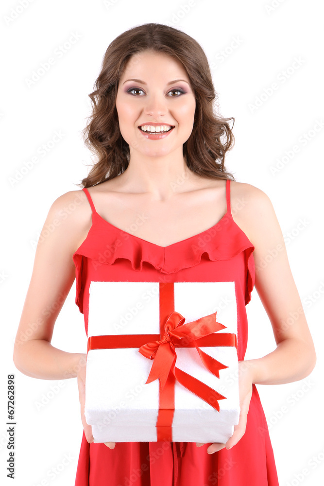 Beautiful young girl in red dress with gift isolated on white Beautiful young girl in red dress with gift isolated on white