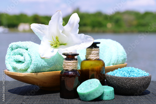 Fototapeta Naklejka Na Ścianę i Meble -  Herbal remedies for massage on bamboo mat, outdoor