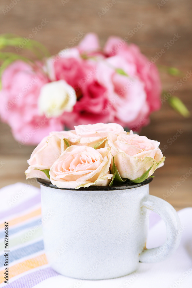 Bouquet of eustoma flowers and creamy roses on wooden Bouquet of eustoma flowers and creamy roses on wooden
