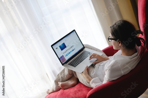 woman using a laptop computer at home