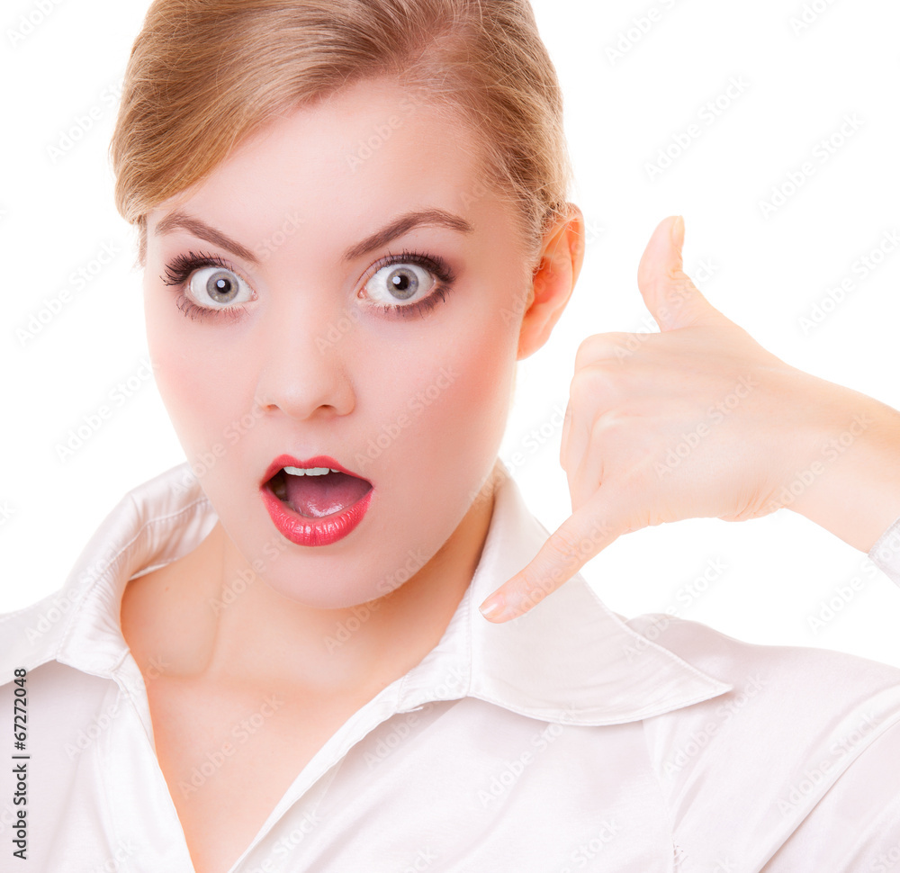 Surprised businesswoman making call me gesture. Surprised businesswoman making call me gesture.