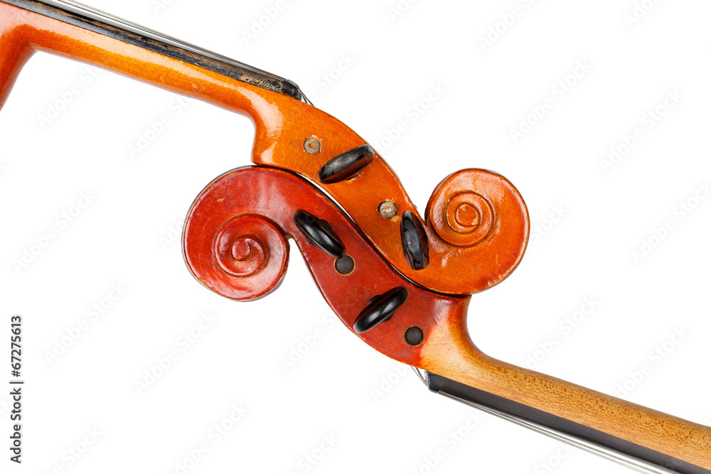 Fototapeta premium Vintage violin scrolls detail isolated on white