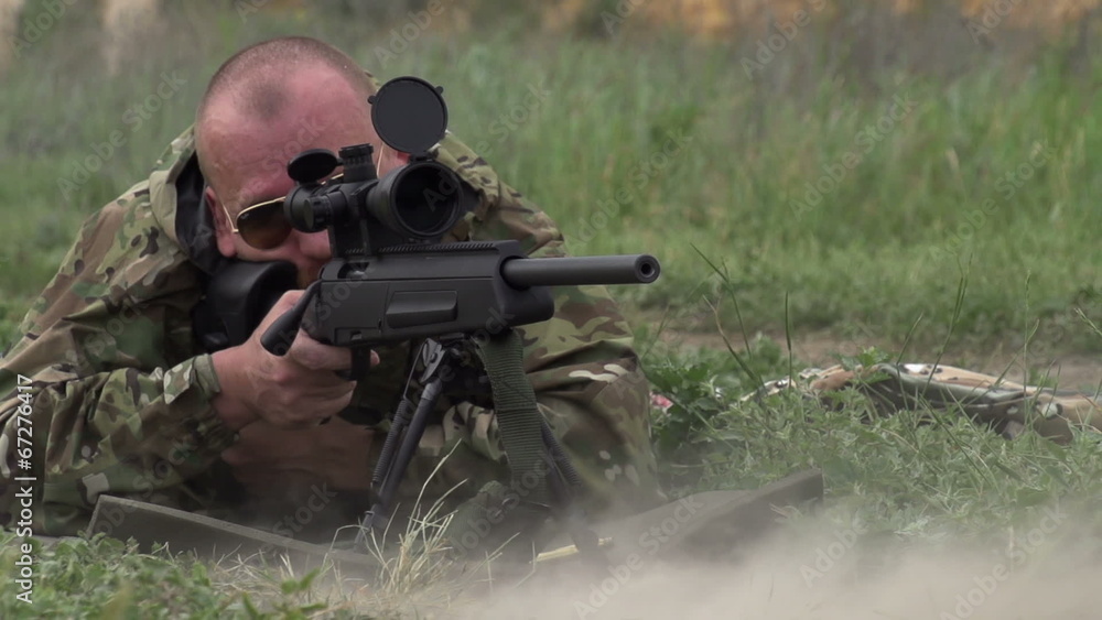 Sniper Shoots at a Target Sniper Shoots at a Target