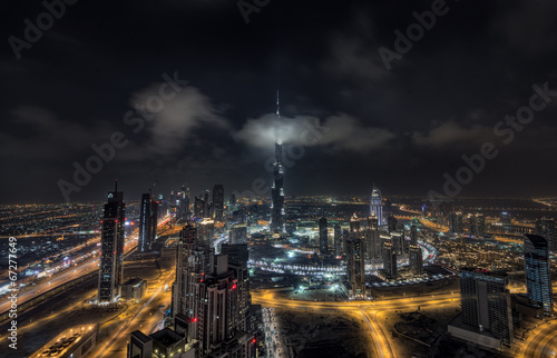 Scattered clouds passing by Burj khalifa and the downtown Dubai