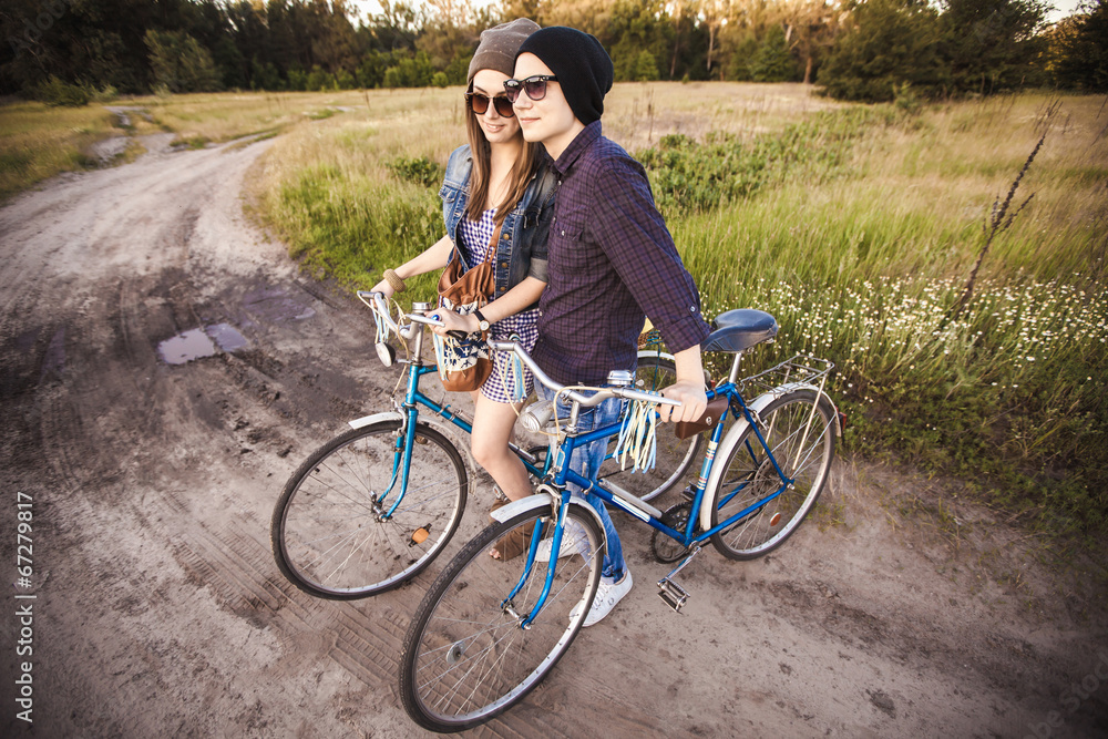 Fototapeta premium Two beautiful hipsters standing outdoor