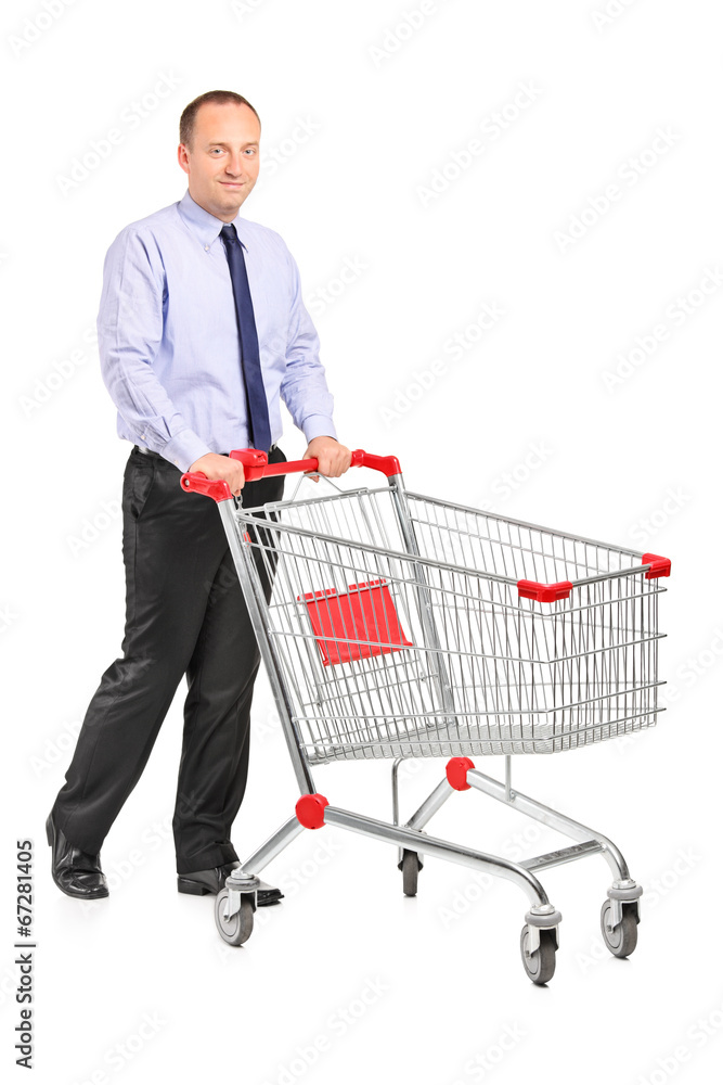 Young man pushing a shopping cart