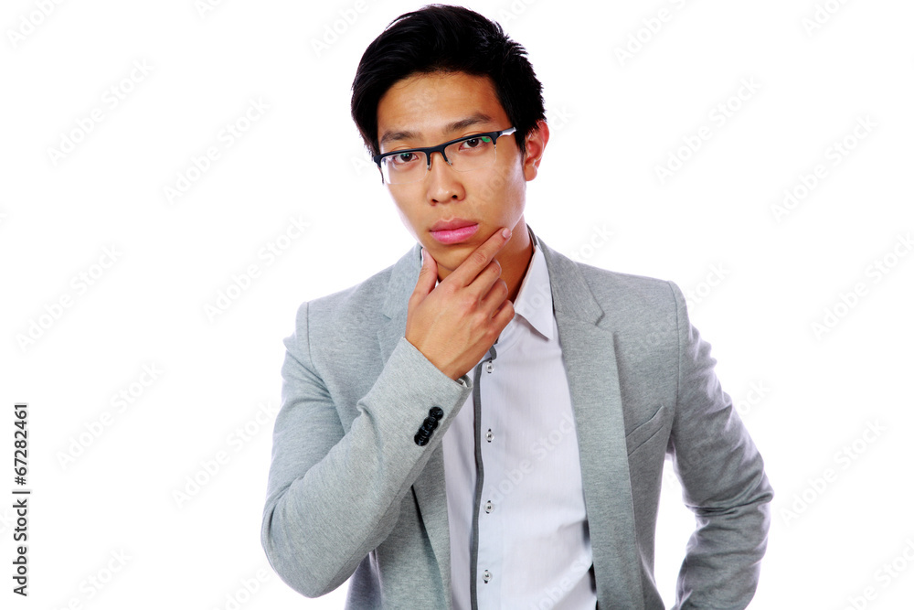 Portrait of a pensive asian man isolated on a white background Portrait of a pensive asian man isolated on a white background