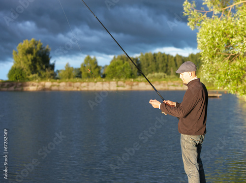  man fishing in a pond