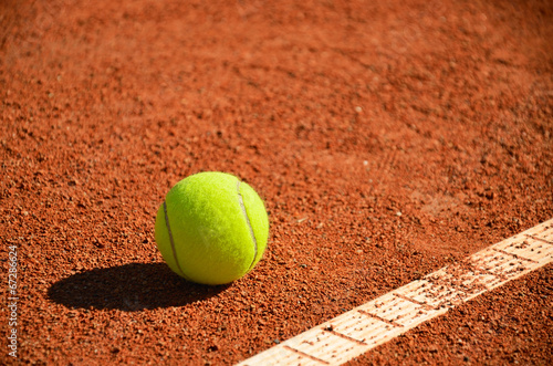 tennis ball near markup diagonal horizontal © Tanya Rusanova