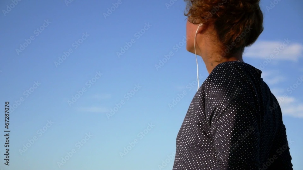 Technology, Music and Happiness Concept - Smiling Young Girl in Technology, Music and Happiness Concept - Smiling Young Girl in