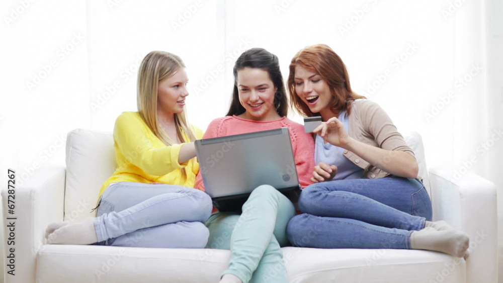 smiling teenage girls with laptop and credit card smiling teenage girls with laptop and credit card