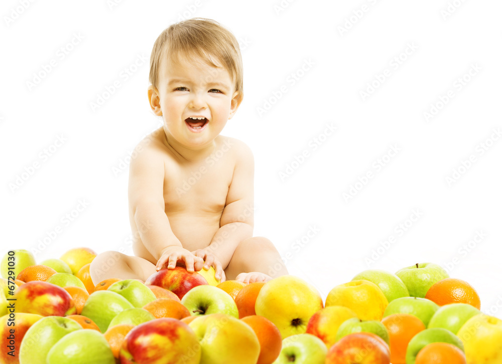 Baby food. Child sitting inside fruits over white background. Baby food. Child sitting inside fruits over white background.