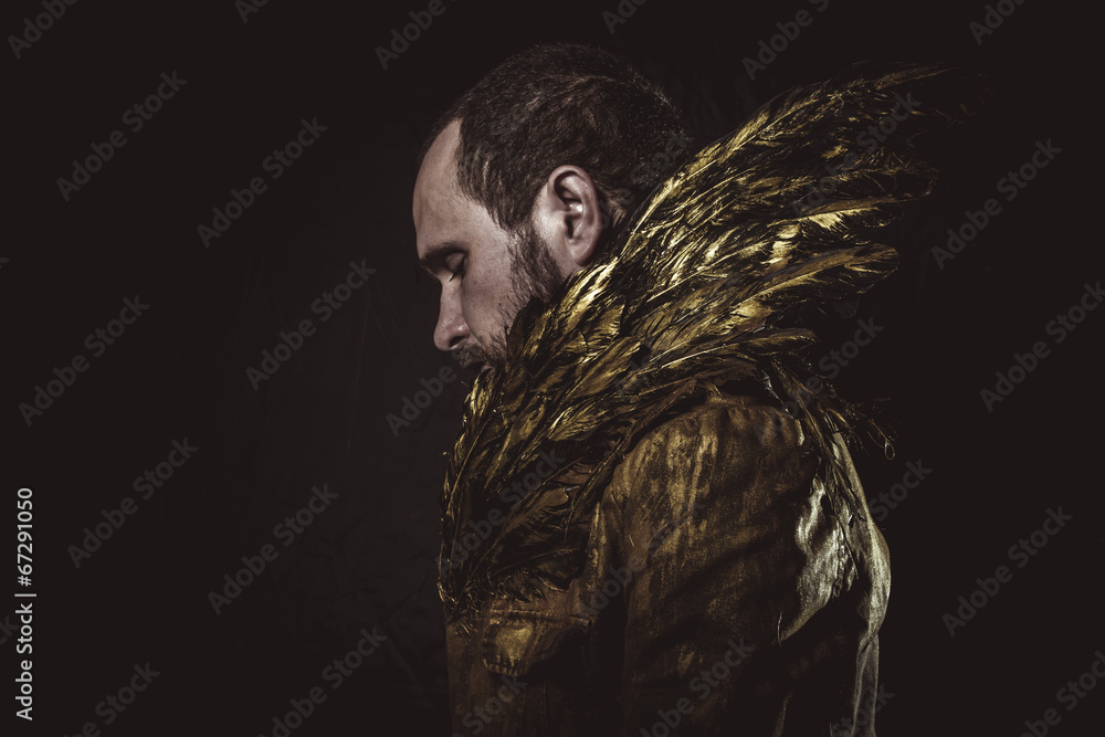 Steampunk, man beard and suit made with golden wings Steampunk, man beard and suit made with golden wings