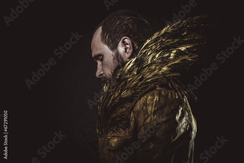 Steampunk, man beard and suit made with golden wings