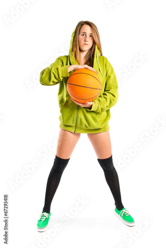 Young girl with basketball over white background
