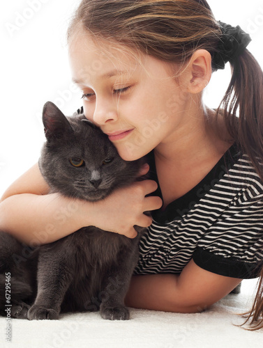 Canvas Print child gently hugs a gray cat