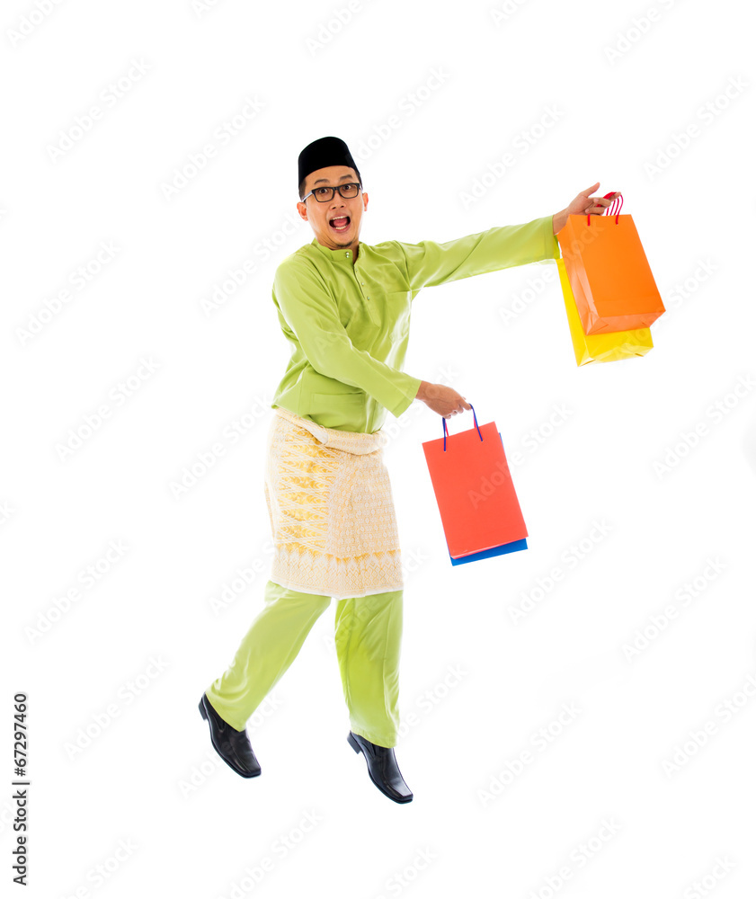 malay male with shopping bags during festival season