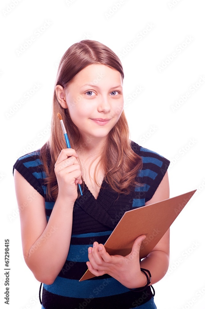 Teen girl holding paintbrush and paper Teen girl holding paintbrush and paper