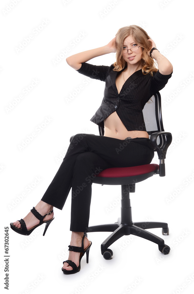 Businesswoman in an armchair isolated on white background Businesswoman in an armchair isolated on white background