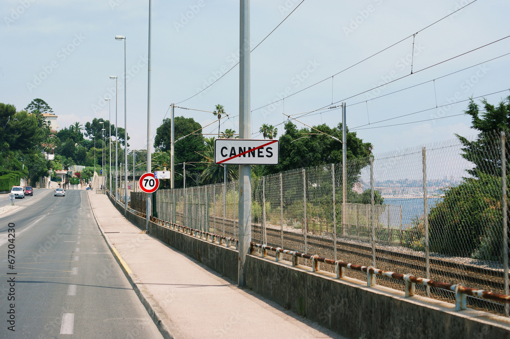 Traffic signs in France, Cannes, road and sea view