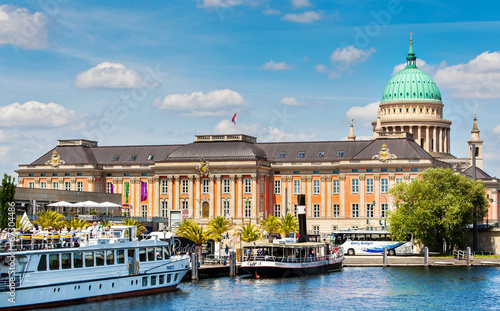 Dock for excursion steamers on the pier in Potsdam with the Brandenburg State Parliament building in the background photo