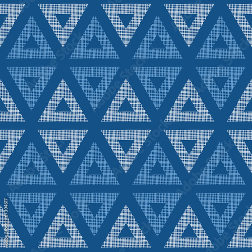 Abstract textile blue triangles ikat seamless pattern background