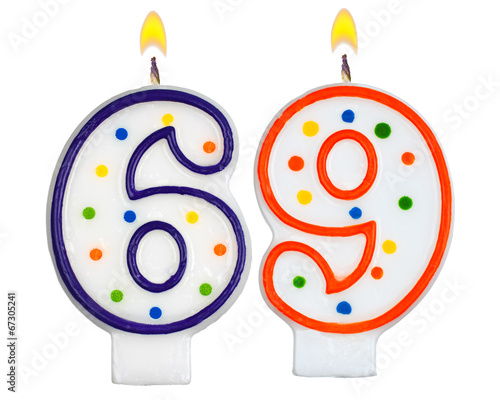 Birthday candles number sixty nine isolated on white background photo