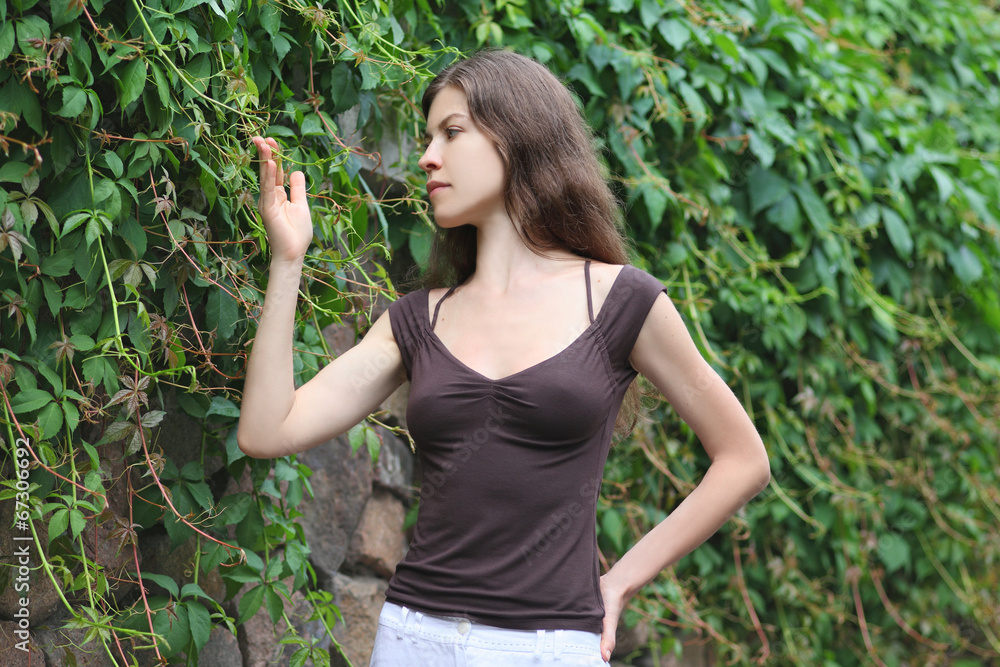 Beautiful Girl Enjoying Nature. Young Woman Contemplate Plant. Beautiful Girl Enjoying Nature. Young Woman Contemplate Plant.