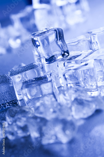 Ice cubes on blue background 