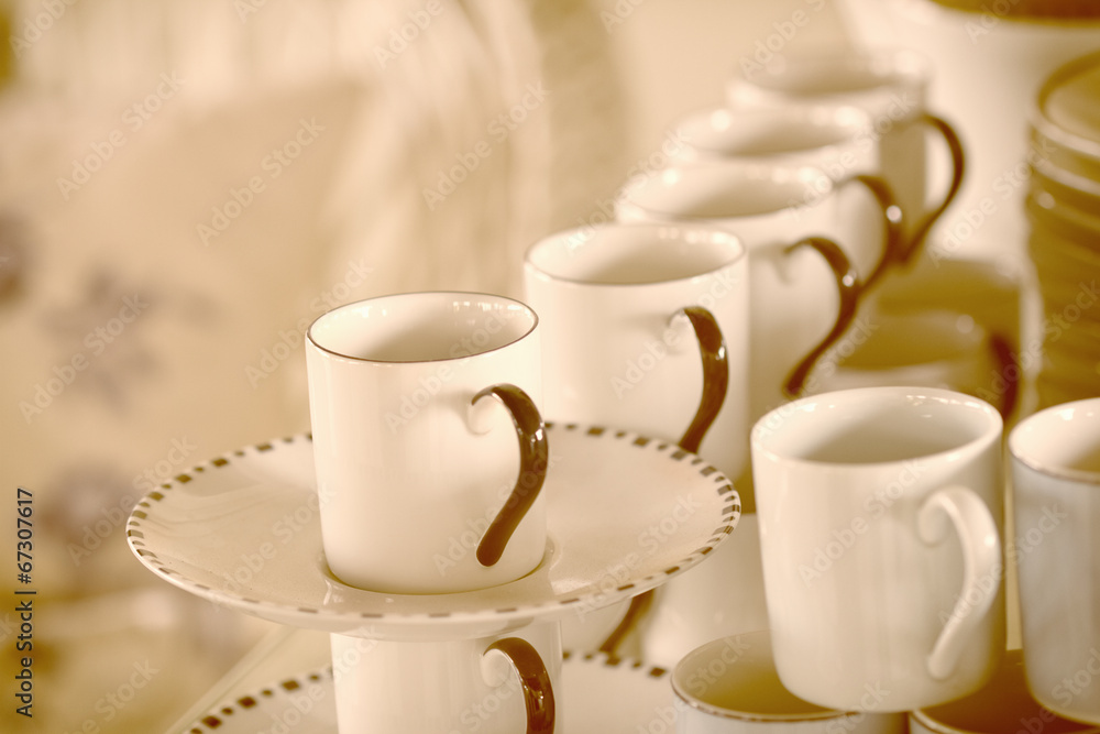 Fototapeta premium Stacked empty tea cups vintage style