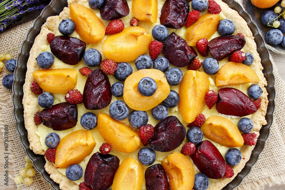 Sweet tart with peaches, plums and blueberries Sweet tart with peaches, plums and blueberries