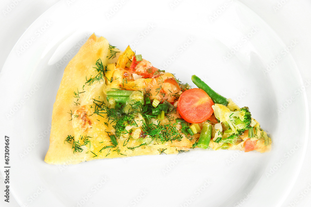 Slice of tasty vegetarian pizza on plate, close up