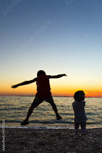 Children playing in the sunset