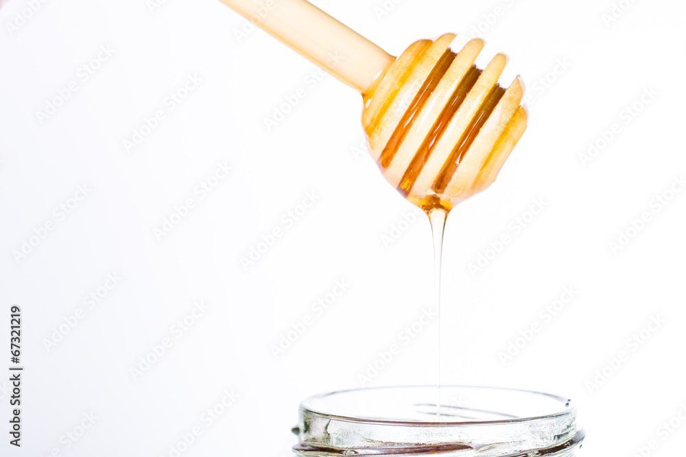 Pure Honey diping and dipper isolated Pure Honey diping and dipper isolated