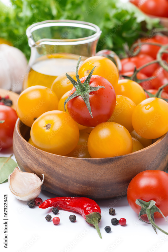 yellow and red cherry tomatoes, olive oil and spices, close-up yellow and red cherry tomatoes, olive oil and spices, close-up